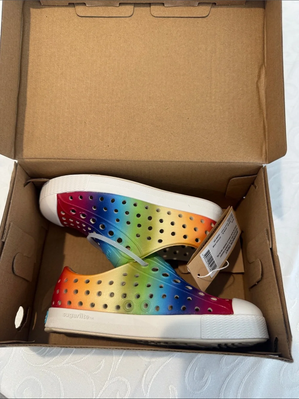 Native Kids Slip-On Sneaker in Rainbow Gradient. Size C8